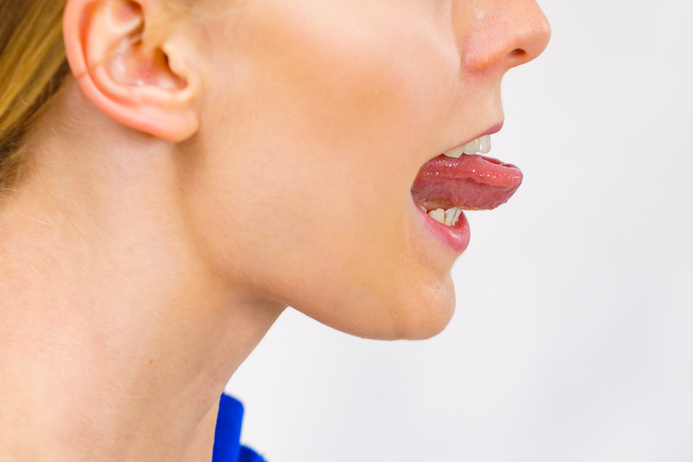 Woman sticks out her tongue